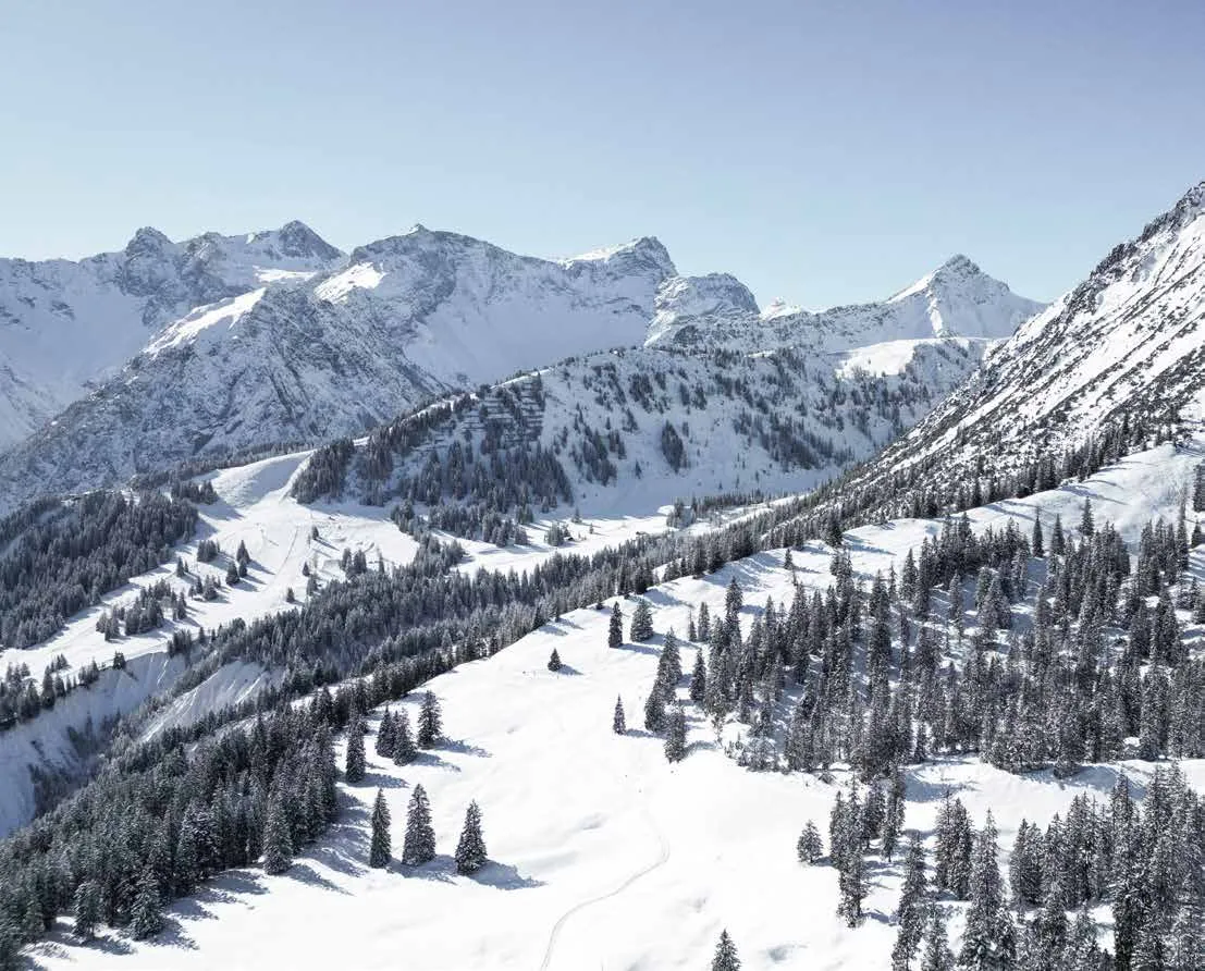 Snow-covered slopes above Elements Residences — second-home status